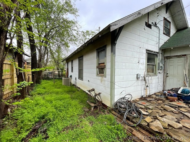 1225 S Quaker Ave, Tulsa, OK 74120 - view of side of home with a central air condition unit