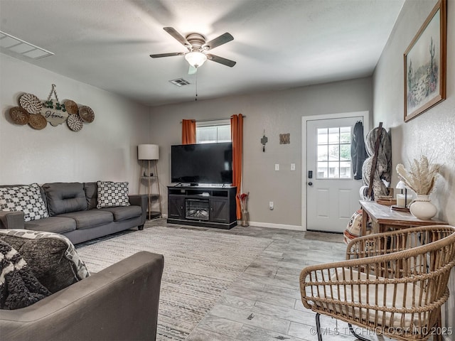 310 W Lee Ave, Sapulpa, OK 74066 - living area featuring a ceiling fan and light wood finished floors