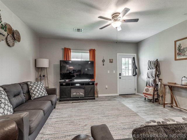 310 W Lee Ave, Sapulpa, OK 74066 - living room featuring ceiling fan and baseboards
