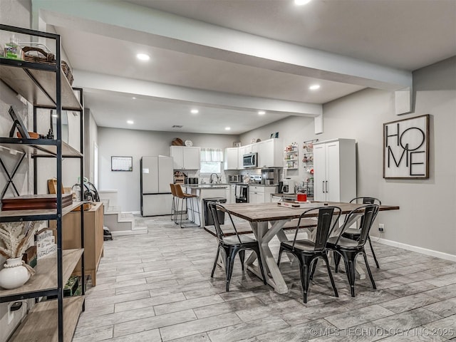 310 W Lee Ave, Sapulpa, OK 74066 - dining space featuring wood finish floors, recessed lighting, and beamed ceiling