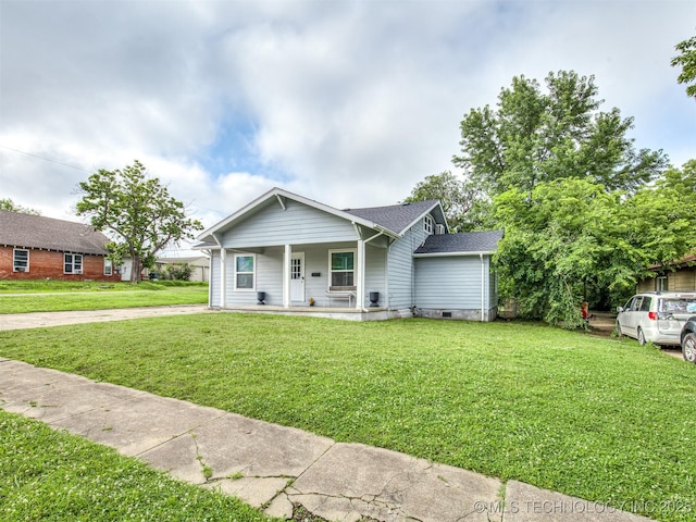 310 W Lee Ave, Sapulpa, OK 74066 - view of front of house featuring covered porch, a front yard, crawl space, and a shingled roof