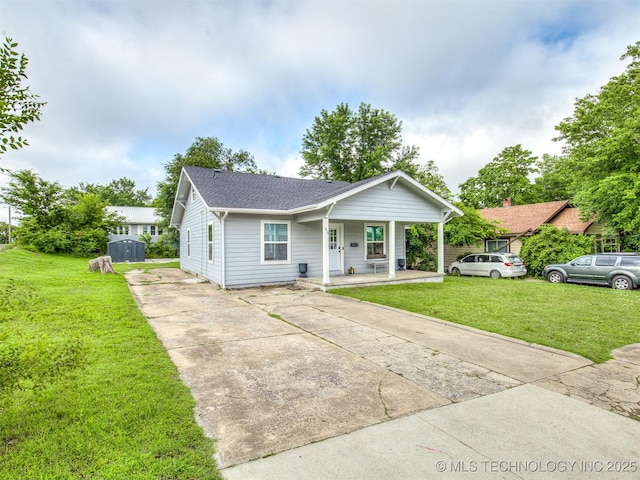310 W Lee Ave, Sapulpa, OK 74066 - bungalow-style house featuring concrete driveway, a porch, a front lawn, and roof with shingles