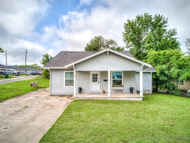 310 W Lee Ave, Sapulpa, OK 74066 - bungalow featuring roof with shingles, a porch, and a front yard