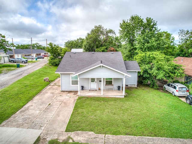 310 W Lee Ave, Sapulpa, OK 74066 - bungalow featuring driveway, a front lawn, roof with shingles, and a porch