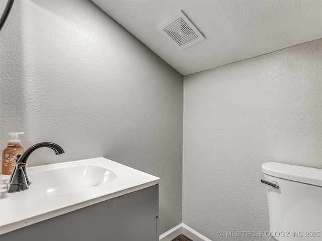 310 W Lee Ave, Sapulpa, OK 74066 - bathroom featuring vanity, wood finished floors, and a textured wall