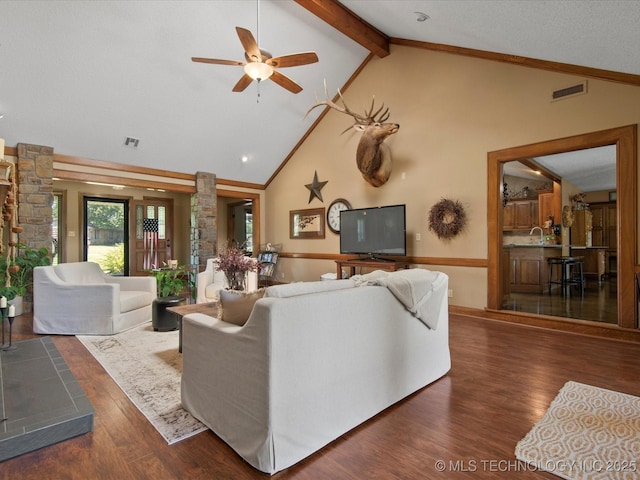 6429 Clear Creek Loop, Bartlesville, OK 74006 - living room featuring decorative columns, ceiling fan, wood finished floors, high vaulted ceiling, and beam ceiling