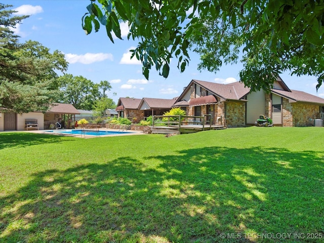 6429 Clear Creek Loop, Bartlesville, OK 74006 - view of yard featuring a deck