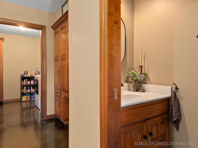 6429 Clear Creek Loop, Bartlesville, OK 74006 - bathroom featuring vanity, a textured ceiling, and concrete flooring