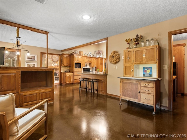 6429 Clear Creek Loop, Bartlesville, OK 74006 - living area with a textured ceiling and finished concrete floors