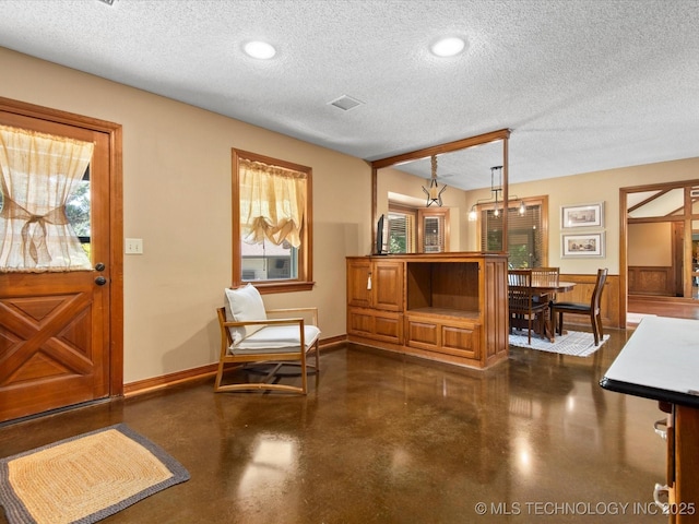 6429 Clear Creek Loop, Bartlesville, OK 74006 - foyer entrance featuring concrete floors and a textured ceiling