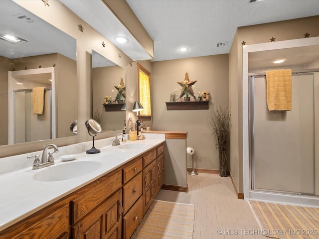 6429 Clear Creek Loop, Bartlesville, OK 74006 - bathroom featuring double vanity, a shower stall, tile patterned flooring, and recessed lighting
