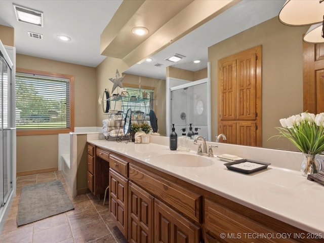 6429 Clear Creek Loop, Bartlesville, OK 74006 - bathroom with vanity, a shower stall, a garden tub, and recessed lighting