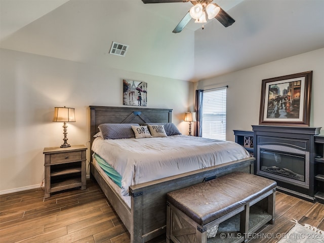 3409 E Quebec St, Broken Arrow, OK 74014 - bedroom with vaulted ceiling, wood finished floors, and a ceiling fan