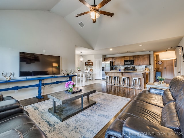 3409 E Quebec St, Broken Arrow, OK 74014 - living area featuring a ceiling fan, wood finished floors, recessed lighting, and high vaulted ceiling