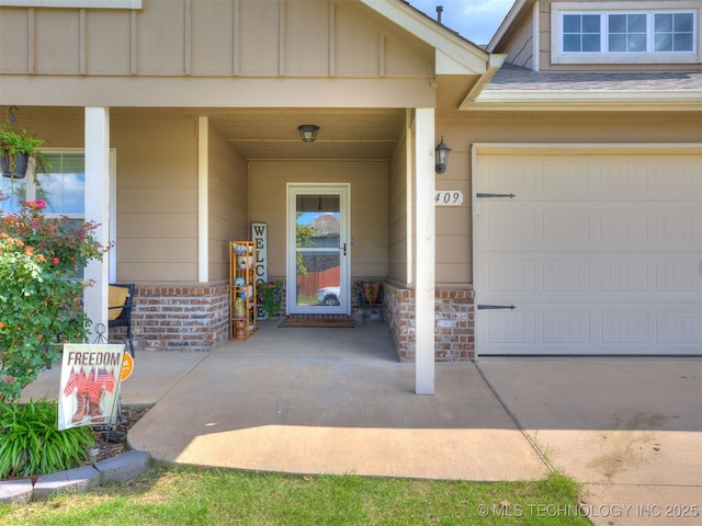 3409 E Quebec St, Broken Arrow, OK 74014 - view of exterior entry with a garage, brick siding, and board and batten siding