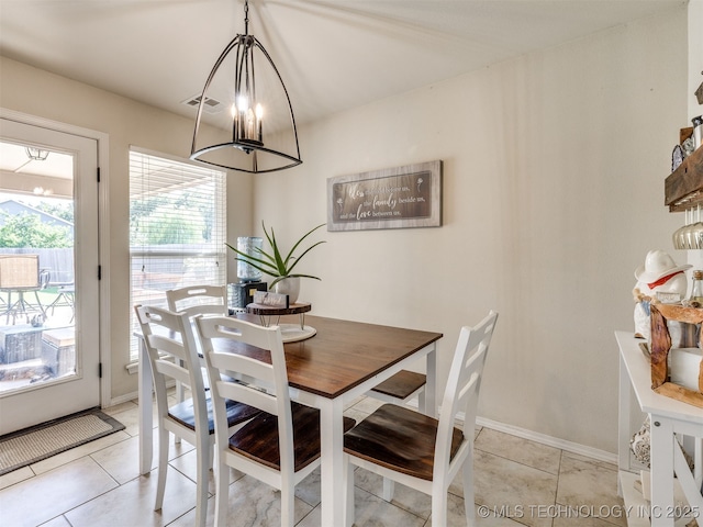 3409 E Quebec St, Broken Arrow, OK 74014 - dining space featuring a chandelier and light tile patterned floors