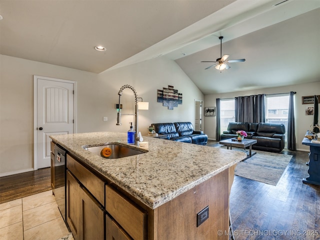 3409 E Quebec St, Broken Arrow, OK 74014 - kitchen featuring ceiling fan, vaulted ceiling, an island with sink, open floor plan, and light stone counters