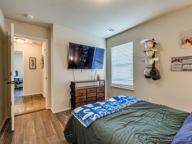 3409 E Quebec St, Broken Arrow, OK 74014 - bedroom with dark wood finished floors and baseboards