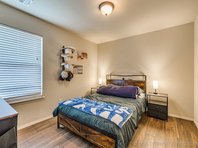 3409 E Quebec St, Broken Arrow, OK 74014 - bedroom with wood finished floors and baseboards