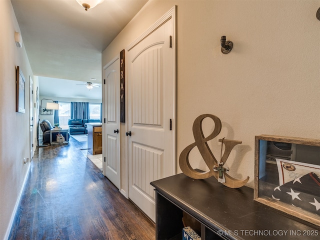 3409 E Quebec St, Broken Arrow, OK 74014 - hall with dark wood-style floors and baseboards