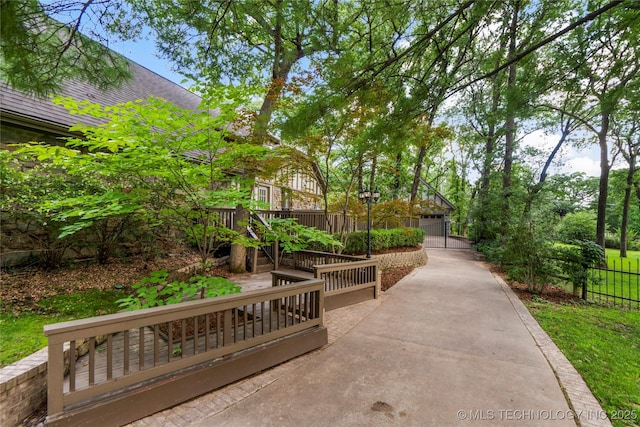6530 E 106th St, Tulsa, OK 74133 - surrounding community featuring a garage, driveway, and a wooden deck