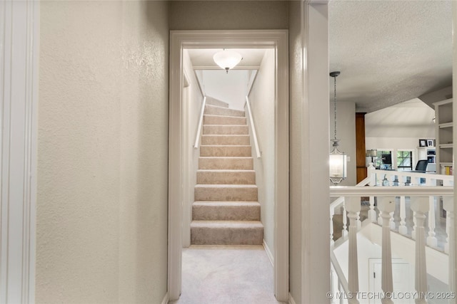 6530 E 106th St, Tulsa, OK 74133 - stairs with a textured wall, carpet floors, and a textured ceiling