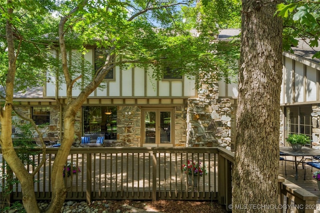 6530 E 106th St, Tulsa, OK 74133 - rear view of house with stone siding and a deck