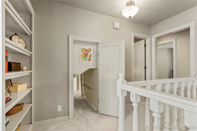 6530 E 106th St, Tulsa, OK 74133 - hall featuring an upstairs landing, carpet, a textured wall, and a textured ceiling