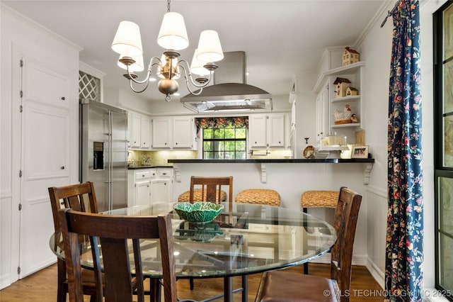 6530 E 106th St, Tulsa, OK 74133 - dining room featuring a chandelier, light wood-style flooring, and ornamental molding