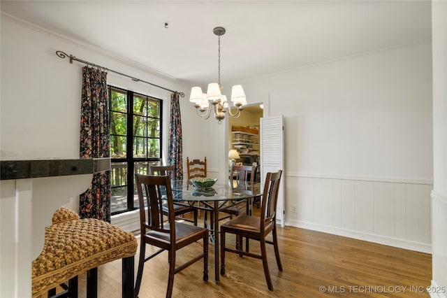 6530 E 106th St, Tulsa, OK 74133 - dining area with a chandelier, wood finished floors, ornamental molding, and wainscoting
