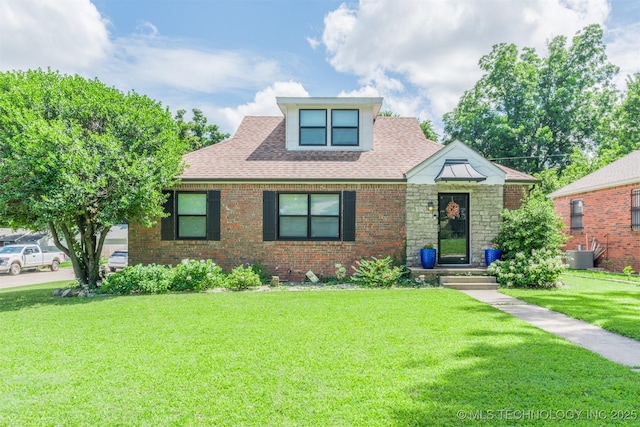 2648 E 2nd St, Tulsa, OK 74104 - view of front facade with a front lawn, roof with shingles, brick siding, and stone siding