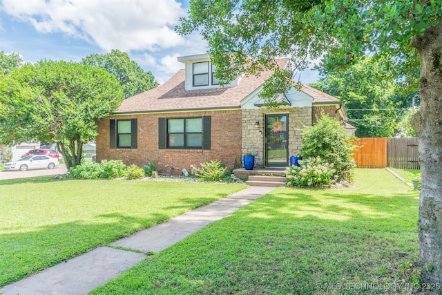 2648 E 2nd St, Tulsa, OK 74104 - bungalow featuring brick siding and a shingled roof
