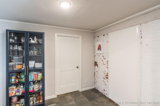 2648 E 2nd St, Tulsa, OK 74104 - rec room with ornamental molding and dark wood-type flooring