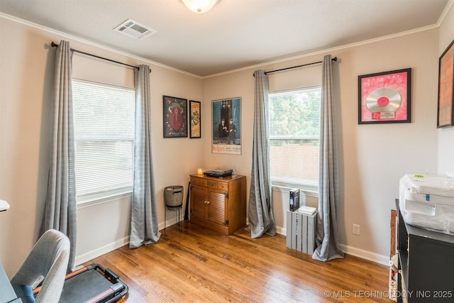 2648 E 2nd St, Tulsa, OK 74104 - home office with light wood-style flooring and crown molding