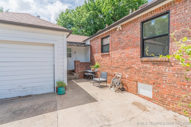 2648 E 2nd St, Tulsa, OK 74104 - view of patio / terrace featuring a garage