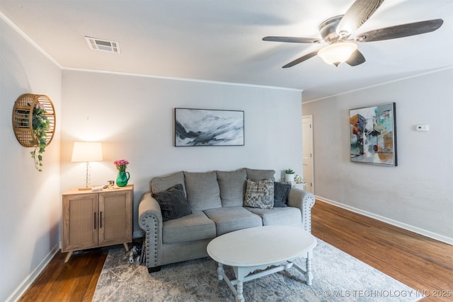 2648 E 2nd St, Tulsa, OK 74104 - living area featuring wood finished floors, a ceiling fan, and ornamental molding