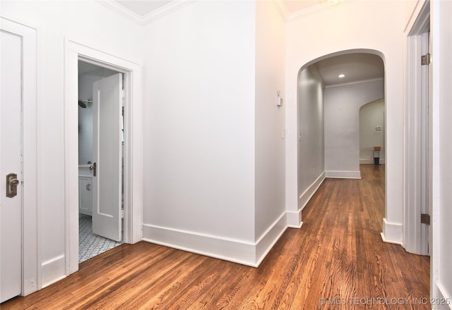 2020 E 14th St, Tulsa, OK 74104 - corridor featuring ornamental molding, arched walkways, and dark wood finished floors