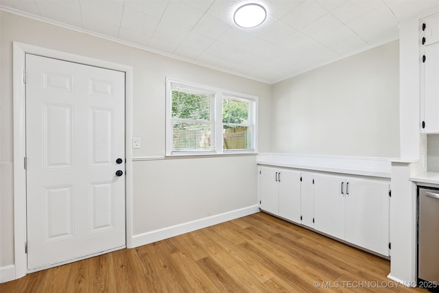 202 W Burnham Ave, Sapulpa, OK 74066 - laundry room with crown molding and light wood-style flooring