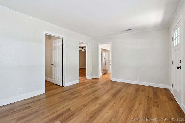 202 W Burnham Ave, Sapulpa, OK 74066 - empty room with light wood finished floors and ornamental molding
