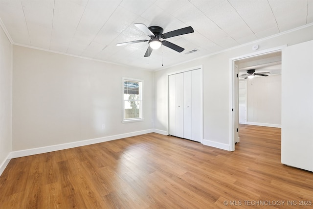 202 W Burnham Ave, Sapulpa, OK 74066 - unfurnished bedroom featuring ornamental molding, light wood-type flooring, a closet, and a ceiling fan