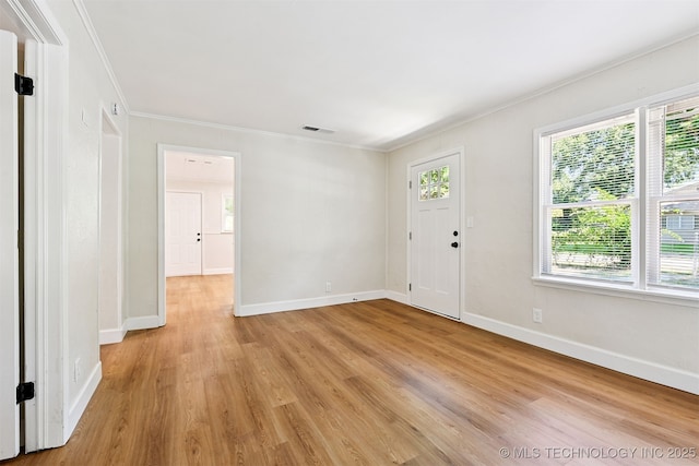 202 W Burnham Ave, Sapulpa, OK 74066 - foyer entrance featuring crown molding and light wood-style floors