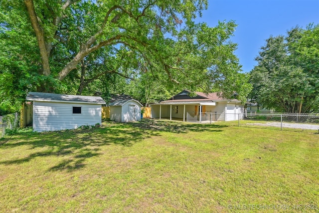 202 W Burnham Ave, Sapulpa, OK 74066 - view of yard with a storage unit, a garage, and driveway