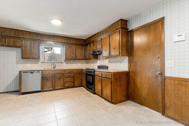 606 N Gum St, Jenks, OK 74037 - kitchen with dishwasher, black / electric stove, wallpapered walls, under cabinet range hood, and light countertops