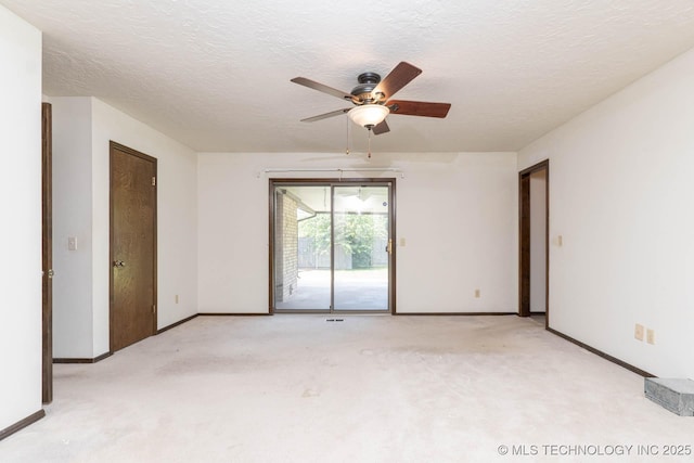 606 N Gum St, Jenks, OK 74037 - spare room featuring a ceiling fan, light carpet, and a textured ceiling