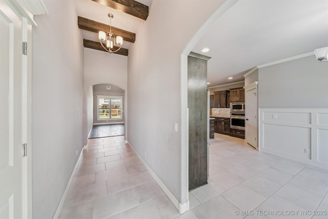 6107 E 127th St N, Collinsville, OK 74021 - corridor with arched walkways, light tile patterned flooring, beamed ceiling, recessed lighting, and a chandelier