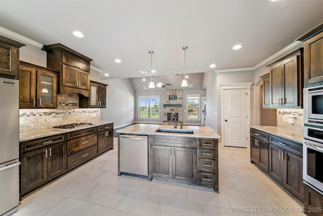 6107 E 127th St N, Collinsville, OK 74021 - kitchen featuring appliances with stainless steel finishes, a fireplace, tasteful backsplash, recessed lighting, and light tile patterned flooring