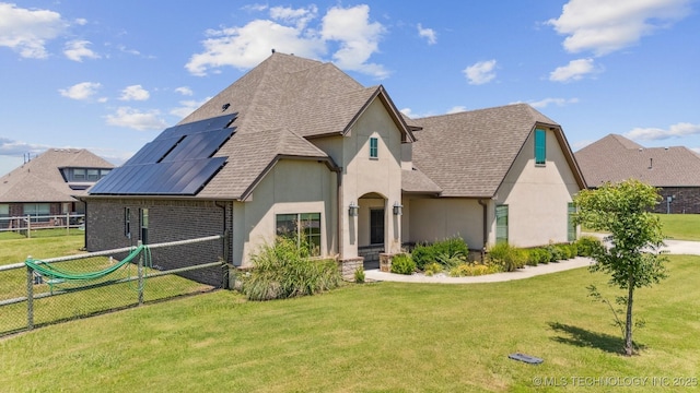 6107 E 127th St N, Collinsville, OK 74021 - view of front of property with stucco siding, solar panels, and a shingled roof