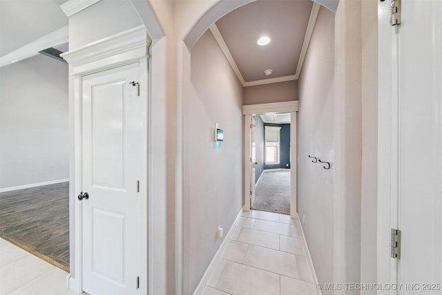 6107 E 127th St N, Collinsville, OK 74021 - hallway with ornamental molding, arched walkways, and light tile patterned floors
