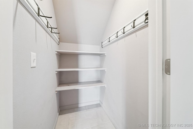 6107 E 127th St N, Collinsville, OK 74021 - spacious closet with light tile patterned flooring and lofted ceiling