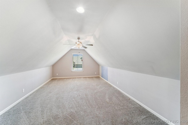 6107 E 127th St N, Collinsville, OK 74021 - additional living space with ceiling fan, vaulted ceiling, and carpet flooring